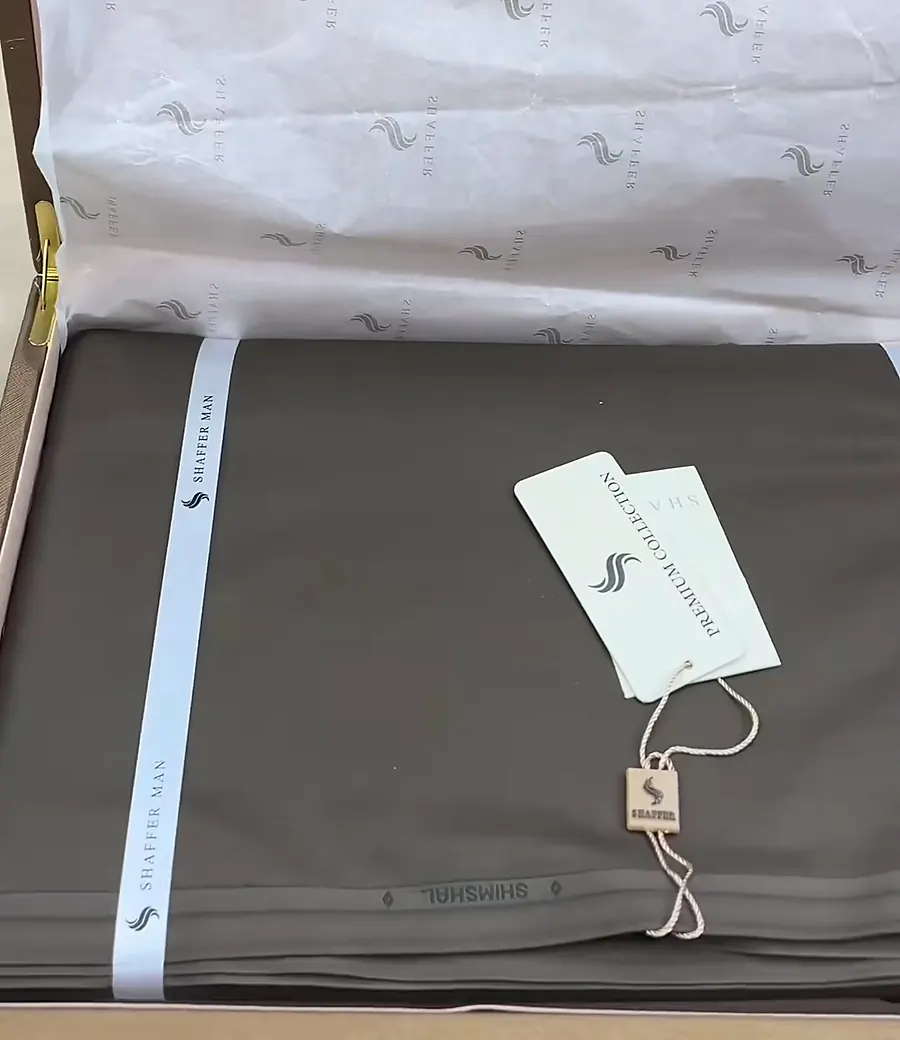 Shaffer Man suit fabric folded in its case with the Premium Collection tag